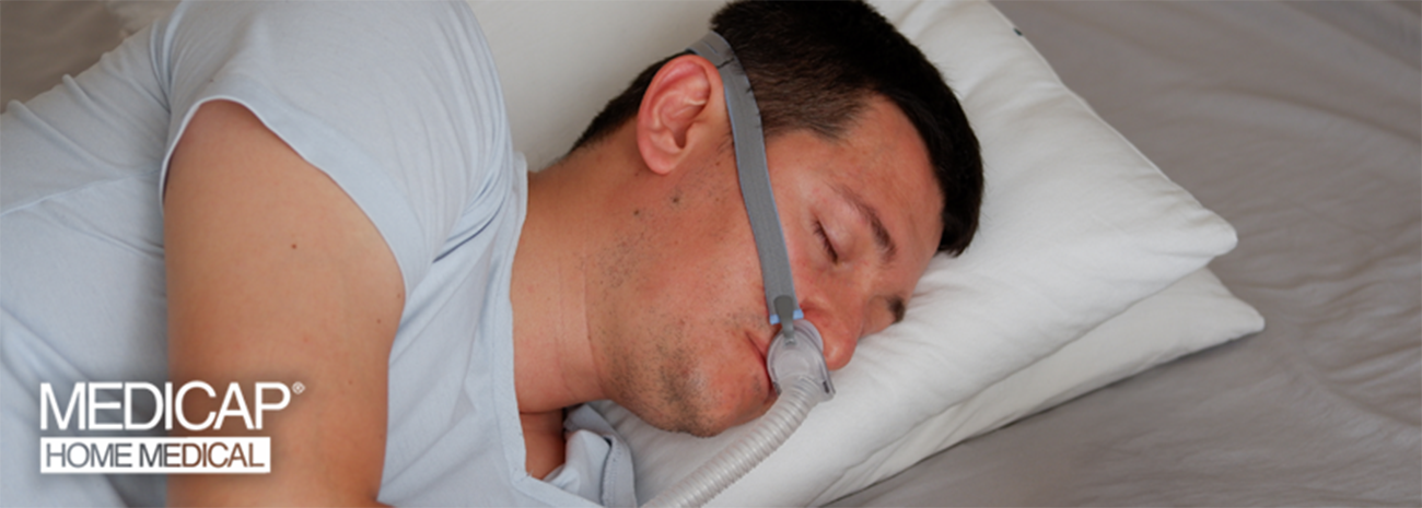 Man sleeping on his side with CPAP mask on