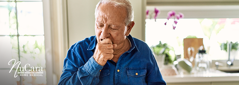 Older gentleman coughing into his hand