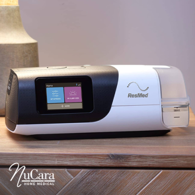 ResMed AirSense 11 CPAP machine on bedside table