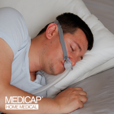 Man sleeping on his side with CPAP mask on